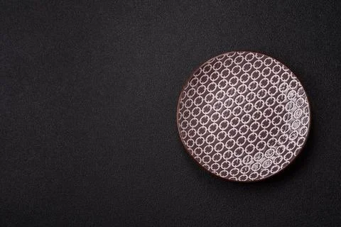 An empty ceramic round plate, kitchen utensils for a dinner table. An empty.. Stock Photos