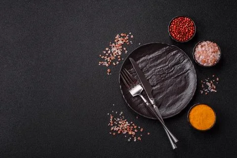 An empty ceramic round plate, kitchen utensils for a dinner table. An empty.. Stock Photos