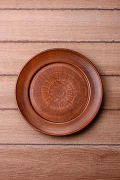 An empty ceramic round plate, kitchen utensils for a dinner table. An empty.. Stock Photos