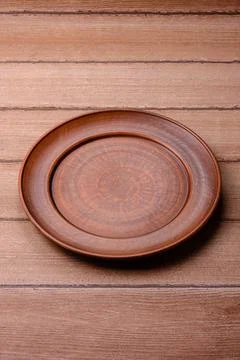 An empty ceramic round plate, kitchen utensils for a dinner table. An empty.. Stock Photos