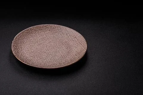 An empty ceramic round plate, kitchen utensils for a dinner table. An empty.. Stock Photos
