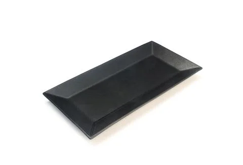 Empty ceramics black plate isolated on white background with clipping path Stock Photos