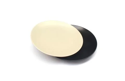 Empty ceramics white and black plate isolated on white background with clip.. Stock Photos