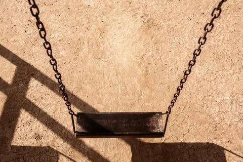 Empty chain swing in playground. Image of children swing set in park. Foto stock