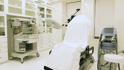 Empty Chair in Bright Plastic Surgery Operating Room Stock Footage