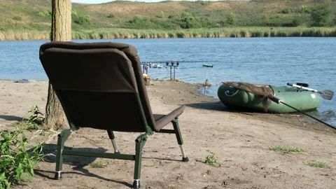 Empty chair for camping waits for its owner to come and enjoy his morning coffee Stock Footage 159737089