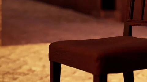Empty chair is positioned on clean floor in warm light at quiet time Stock Footage 342052580
