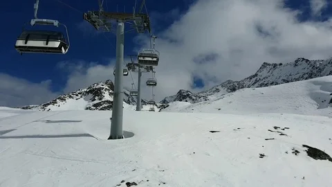 Empty chairlift going up the mountain. Video stock 123554118