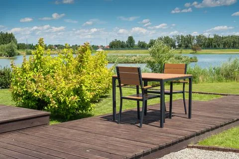 Empty chairs and table in park Stock Photos
