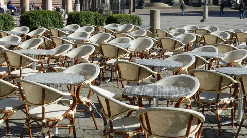 Empty chairs and tables of a cafe on Bremen's market square Stock Footage 127082830