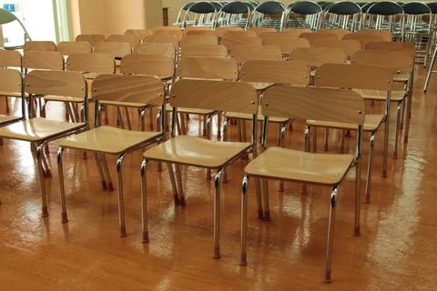 Empty chairs in event space setup Stock Photos