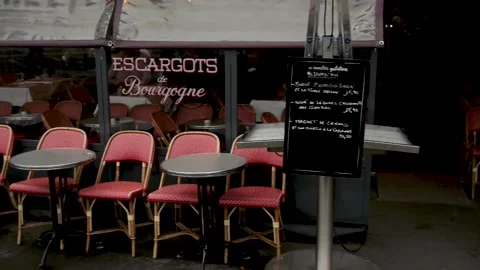 Empty chairs in front of a decorated Parisian cafe Stock Footage 145716846