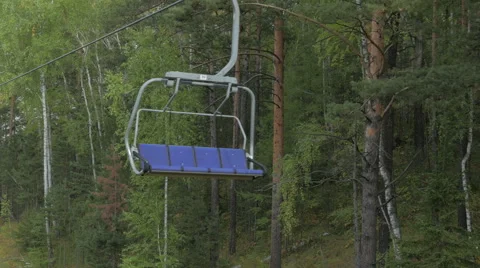 Empty chairs of a ropeway of oncoming traffic Stock Footage 55072942