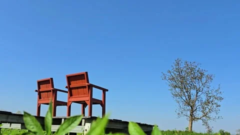 Empty Chairs Under Clear Blue Sky Stock Footage 326222344