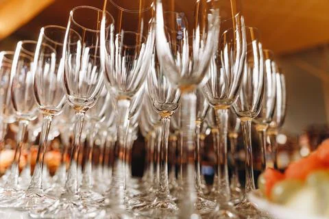 Empty Champagne glasses on serving tray. Stock Photos