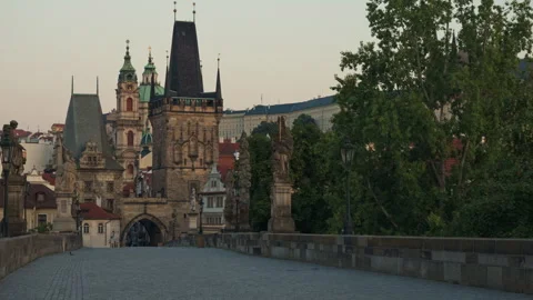 Empty Charles Bridge in Prague at morning light with historic tower view 動画素材 341817868