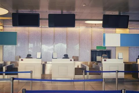 Empty check-in counters with electronic boards at the airport Foto stock