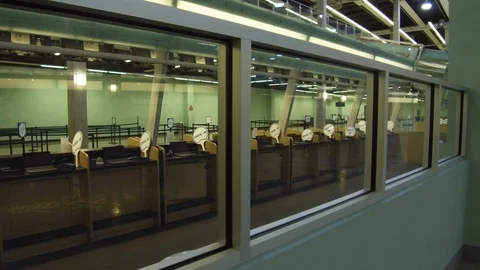 Empty check-in counters seen through glass at Port Everglades terminal 25 Stock Footage 117749115