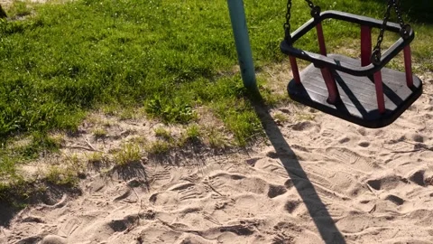 Empty Child S Swing Set in Daytime Park with Sand and Grass Outdoor Playgro.. Stock Footage 335616167
