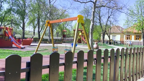 Empty children playground during quarantine by reason of Covid-19 curfew. Stock Footage 128746119