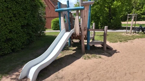 Empty children slide on playground park. Outdoor shot of a kids play park Stock Footage 336332111