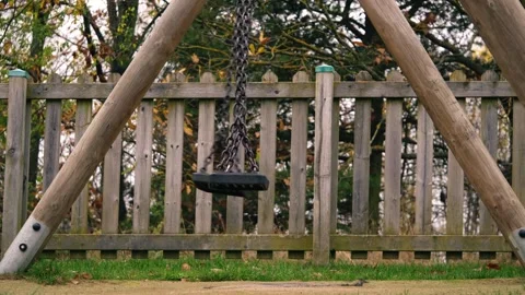 Empty children swing in adventure playground park Stock Footage 292997793