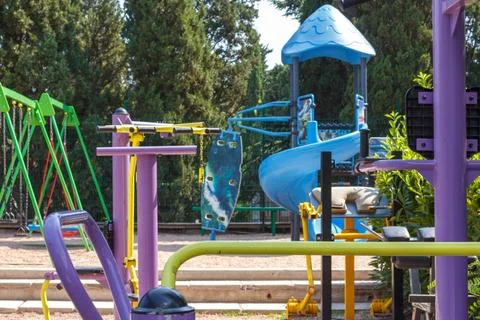 Empty children's Playground in the Park, without people and children. Quarantine Stock Photos
