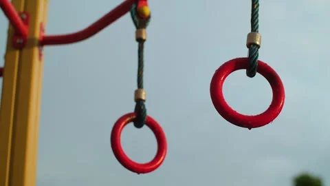 Empty children's playground in the rain. Rain drops falling on playground for Stock Footage 251734703
