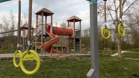 Empty children's playground with warning tape during COVID-19 epidemics Video stock 128211105