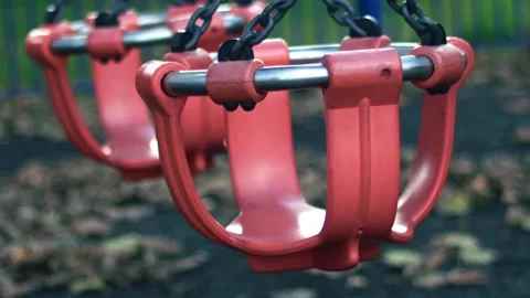Empty Childrens swing moving in park play area Stock Footage 320067432