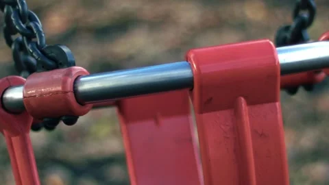 Empty Childrens swing moving in park play area Stock Footage 320564157