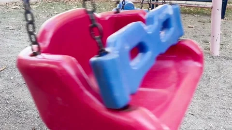 Empty children's swings Stock Footage 220613591