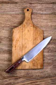Empty chopping board with a knife Stock Photos