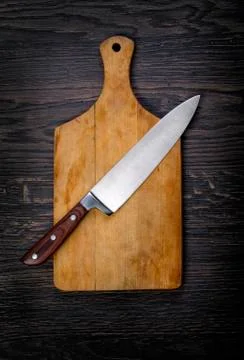Empty chopping board with a knife Stock Photos