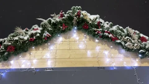 Empty christmas background. Snow gently falls as Christmas wreaths Video stock 317627737