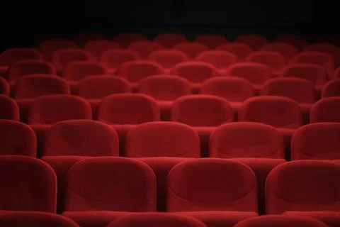 Empty cinema hall with red seats. Movie theater. Stock Photos