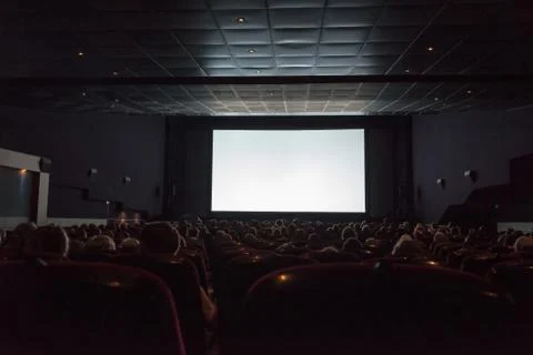 Empty cinema screen with audience Stock Photos