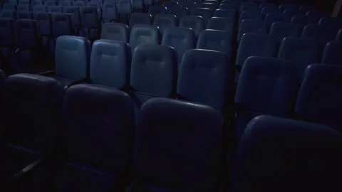 Empty Cinema Seats in Flickering Screen Light Stock Footage 314197240