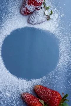 Empty circle area covered with sugar and fresh strawberry on background with  Stock Photos