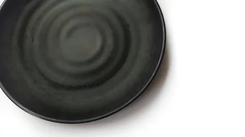 Empty circle black plate with ceramic melamin material Stock Photos