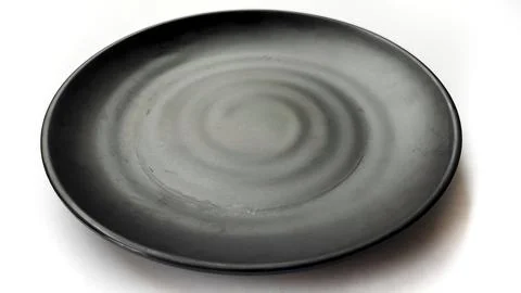 Empty circle black plate with ceramic melamin material Stock Photos