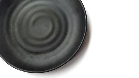 Empty circle black plate with ceramic melamin material Stock Photos