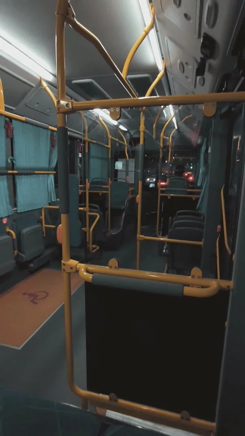 Empty City Bus Interior View During Night Ride with City Lights Stock Footage 329184874