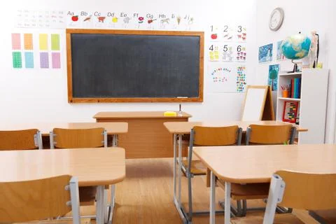 Empty class room of elementary school Stock Photos