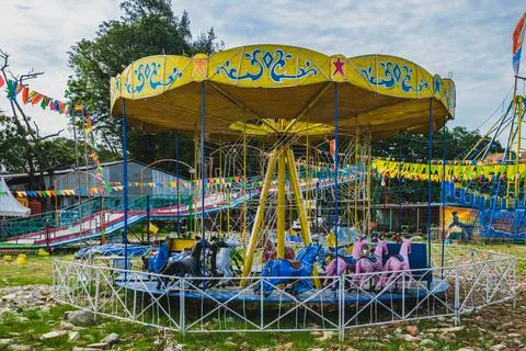 Empty classic horse carousel ride at an outdoor local carnival Stock-Fotos