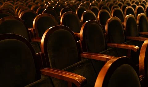 Empty Classic Theater Auditorium with Rows of Velvet Seats and Wooden Armrest Stock Photos