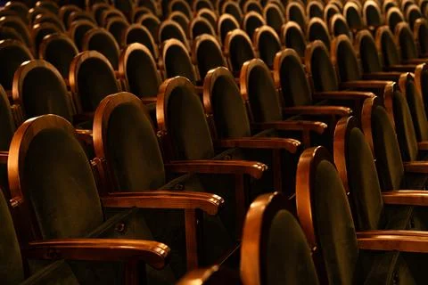 Empty Classic Theater Auditorium with Rows of Velvet Seats and Wooden Armrest Stock Photos