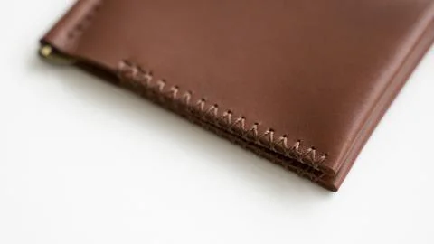 Empty classics brown leather handmade money clip wallet on white background Stock Photos