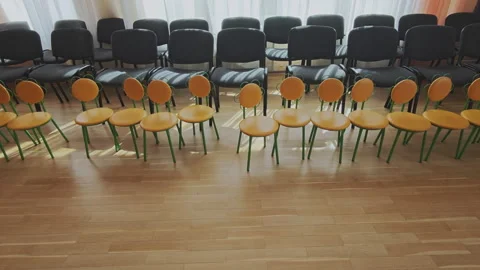 Empty classroom with chairs for adults and children facing each other. Space Stock Footage 345970793