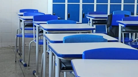 An empty classroom with chairs and cabinets, ready to receive the students. Stock Footage 330304338